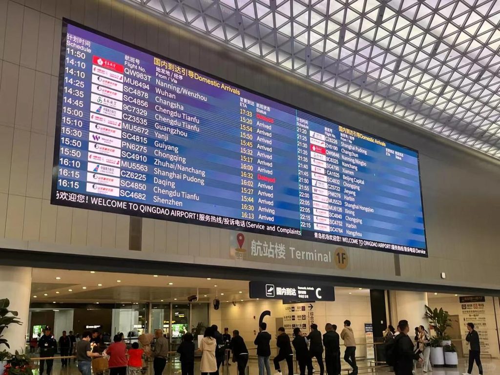 Flight information LED display screen in an airport terminal